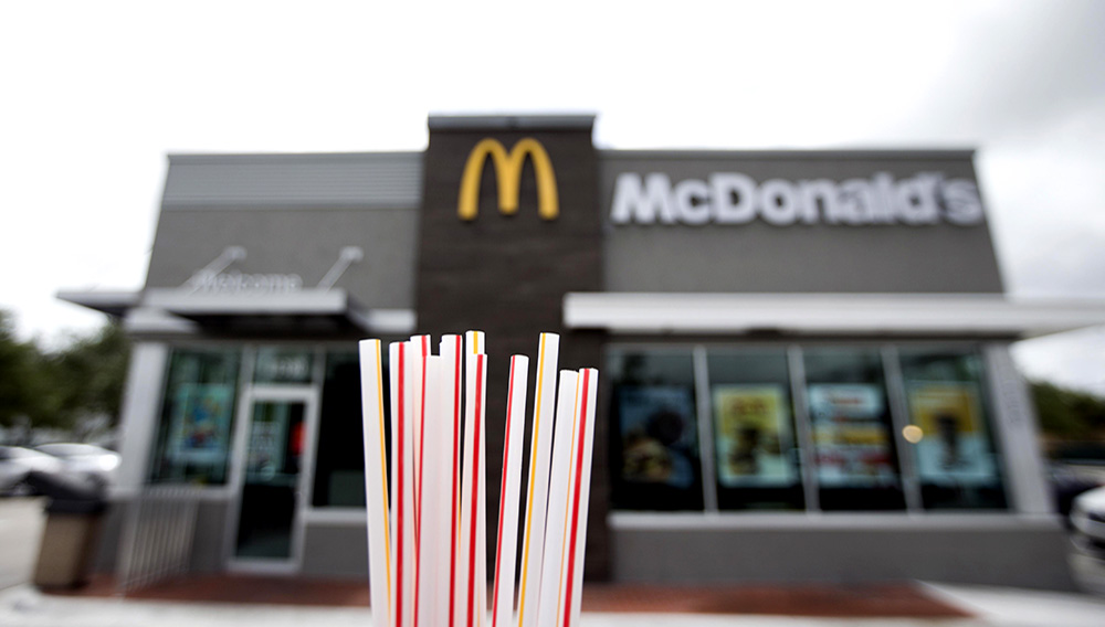 In this May 24, 2018, file photo, plastic straws from a McDonald's restaurant are shown in Doral, Fla. McDonald’s said Friday, June 15, 2018 it will switch to paper straws at all its locations in the United Kingdom and Ireland, and test an alternative to plastic ones in some of its U.S. restaurants later this year. (AP Photo/Wilfredo Lee, File)