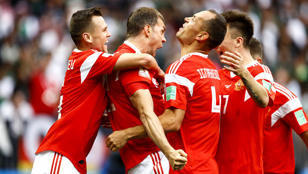 Artem Dzyuba of Russia celebrates after he scores his team's third goal during the 2018 FIFA World Cup match against Saudi Arabia on June 14.