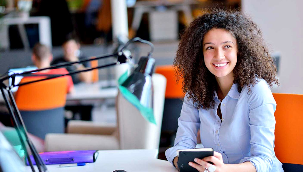 Successful business woman working at the office. Photo: Shutterstock