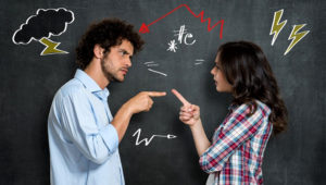 Discussion Between Guy And Girl Over Gray Background. Stock Photo/123RF.com