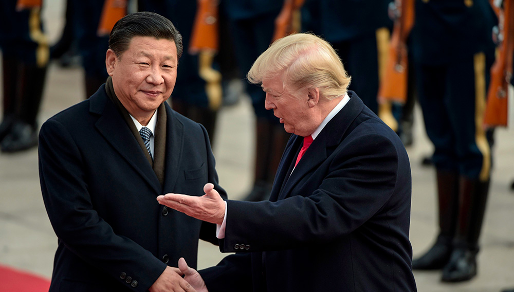 China’s President Xi Jinping (L) and US President Donald Trump attend a welcome ceremony at the Great Hall of the People in Beijing on November 9, 2017. (FRED DUFOUR/AFP/Getty Images)