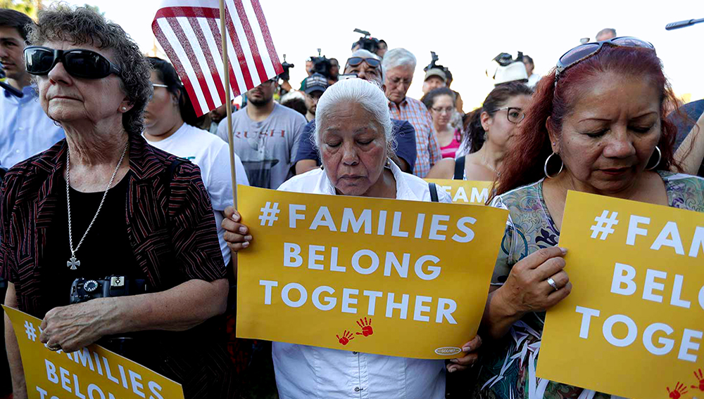 Protesters pray during a Rally for Our Children event to protest a new "zero-tolerance" immigration policy that has led to the separation of families. (AP Photo / Eric Gay)