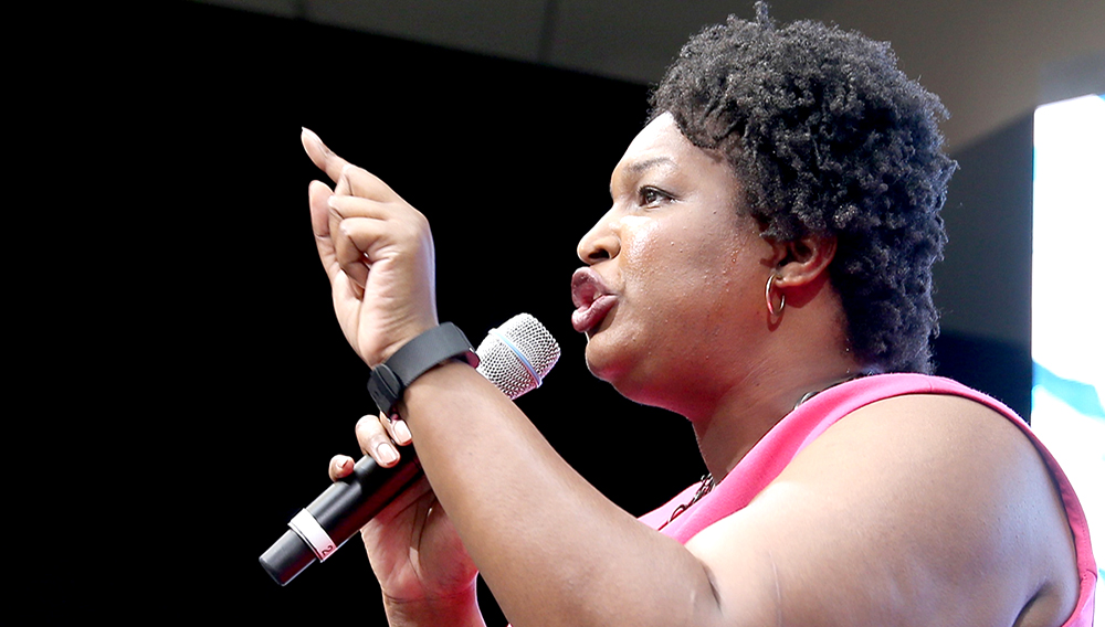 PHILADELPHIA, PA - JULY 27: House Minority Leader for the Georgia General Assembly, Stacey Abrams speaks onstage at EMILY's List Breaking Through 2016 at the Democratic National Convention at Kimmel Center for the Performing Arts on July 27, 2016 in Philadelphia, Pennsylvania. (Photo by Paul Zimmerman/Getty Images For EMILY's List)