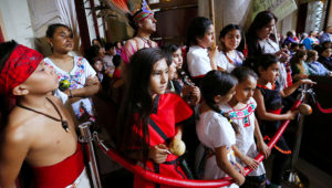 Children listen as L.A. Councilman Mitch O'Farrell, who is a member of the Wyandotte Native American Tribe makes an appeal to the Los Angeles City council meeting celebrating Native American Heritage Month at City Hall on Friday as L.A. officials are weighing a proposal to replace Columbus Day in the city of Los Angeles with Indigenous People's Day. (Al Seib / Los Angeles Times)