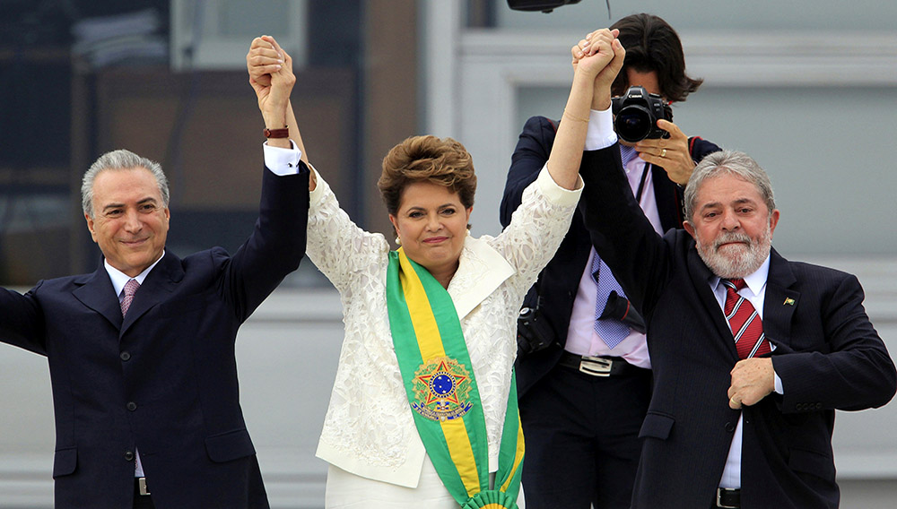 Happier times: Temer, Rousseff and Lula as Brazil’s first female president is sworn into office in 2011. Paulo Whitaker/Reuters