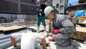 Vietnamese trainees work at a building site in Tokyo on May 22. (Photo by Ken Kobayashi)