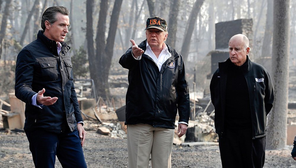President Donald Trump talks with then Gov.-elect Gavin Newsom (left) and as California Gov. Jerry Brown listens during a visit to a neighborhood impacted by the wildfires in Paradise, California, in November. | AP