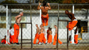 Inmates at Chino State Prison exercise in the yard December 10, 2010 in Chino, California. (Photo by Kevork Djansezian/Getty Images)