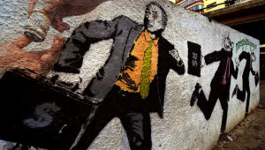 Graffiti con la imagen del Presidente Michel Temer corriendo con una maleta de dinero es visto en el centro de Sao Paulo. | Alamy.es