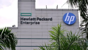 At the tech firm's Alexandra Road office, a new HPE logo has gone up; it is a green box signifying a window of future opportunities. The old logo with a blue background is retained by HP Inc. | PHOTO: DIOS VINCOY JR FOR THE STRAITS TIMES