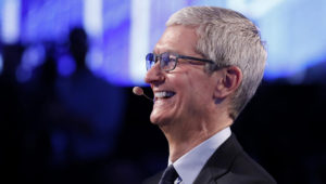 Tim Cook, plenty to smile about. | REUTERS/BRENDAN MCDERMID
