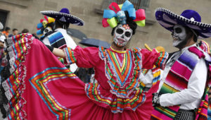Performers in costume attend a Day of the Dead parade in Mexico City, Sunday, Oct. 27, 2019. The parade on Sunday marks the fourth consecutive year that the city has borrowed props from the opening scene of the James Bond film, "Spectre," in which Daniel Craig's title character dons a skull mask as he makes his way through a crowd of revelers. Photo: Ginnette Riquelme, AP