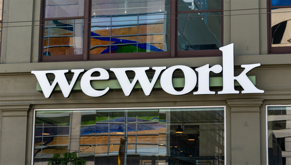 WeWork sign on shared coworking space of The We Company startup at South of Market (or SoMa) neighborhood - San Francisco, California, USA - July 12, 2019. Shutterstock