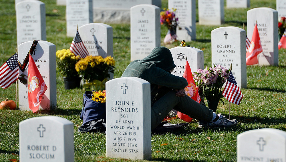 An Unidentified Woman Mourns in Section 60 of Arlington National Cemetery on Veteran's Day in Arlington Virginia Usa 11 November 2013 Section 60 is the Final Resting Place For the Majority of Casualties at Arlington National Cemetery That Died From Operation Iraqi Freedom in Iraq and Operation Enduring Freedom in Afghanistan United States Arlington. EFE/Michael Reynolds