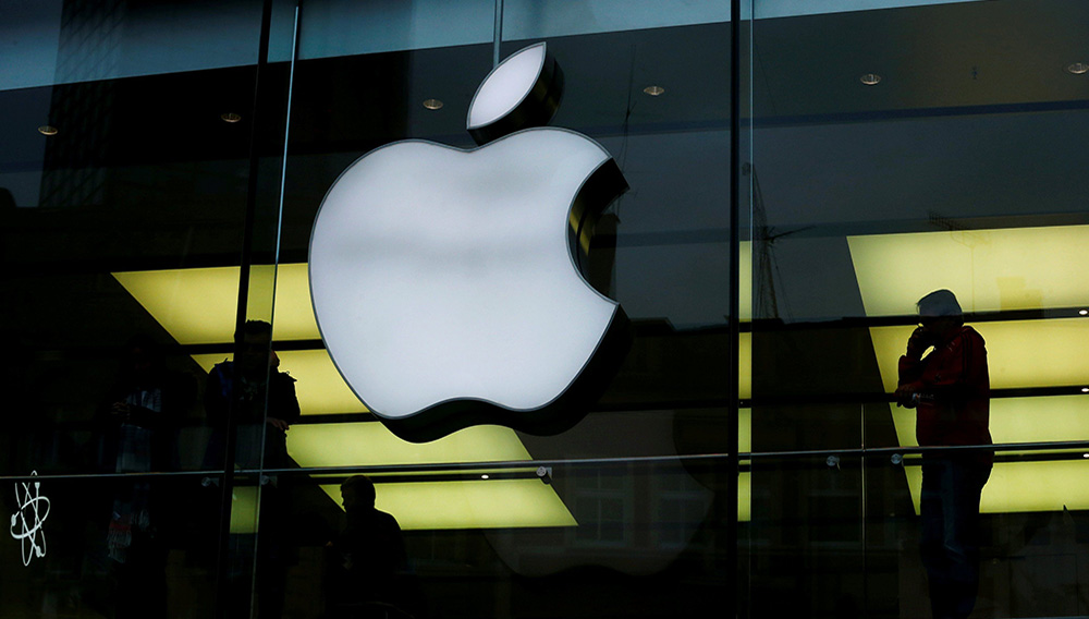 An Apple logo is seen on the building's facade as activists from the anti-globalisation organisation Attac hold the protest against alleged tax evasion by Apple company in front of an Apple store in Frankfurt, Germany, March 10, 2018. REUTERS/Ralph Orlowski/File Photo