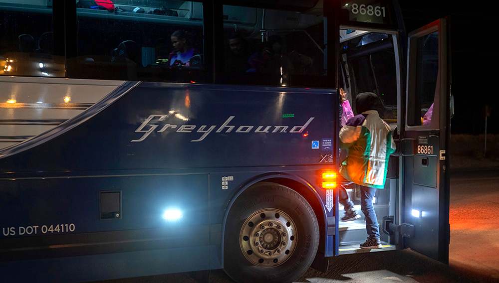 Passengers board a Greyhound bus on Jan. 3, 2019. Paul Ratje—AFP/Getty Images