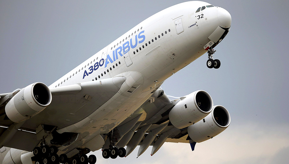 In this June 18, 2015, file photo, an Airbus A380 takes off for its demonstration flight at the Paris Air Show in Le Bourget airport, north of Paris. Commercial airliner maker Airbus is releasing 2019 earnings on Thursday, Feb. 12. (AP Photo/Francois Mori)