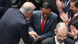 The PM and Mr Widodo shake hands before his address to the House of Representatives. | AAP