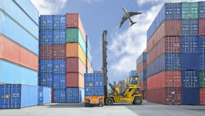 Crane lifter handling container box loading to truck. | Ake1150/Fotolia