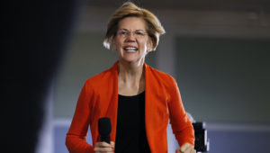 Democratic presidential candidate Sen. Elizabeth Warren (D-Mass.) arrives to speak at a town hall meeting at Grinnell College in Grinnell, Iowa, on Monday. (Charlie Neibergall/AP)