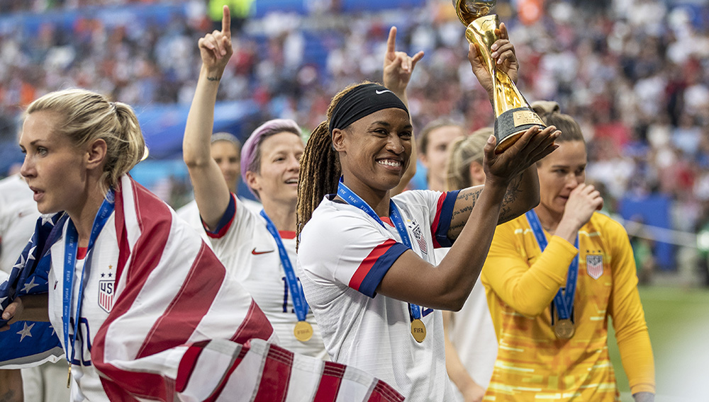 LYON, FRANCE - JULY 07: Jessica McDonald of the USA celebrates with the FIFA Women's World Cup Trophy following her team's victory in the 2019 FIFA Women's World Cup France Final match between The United States of America and The Netherlands at Stade de Lyon on July 07, 2019 in Lyon, France. (Photo by Maja Hitij/Getty Images)