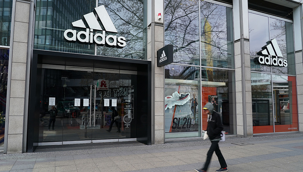 A man walks past a temporarily closed Adidas store during the coronavirus crisis on April 15, 2020 in Berlin, Germany. Photo: Sean Gallup/Getty Images