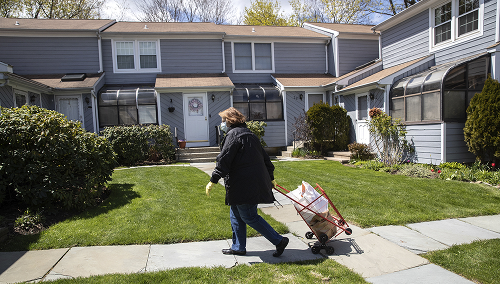 Georgette Penzavecchia delivers bags of groceries to seniors isolated in their homes on April 22, 2020 in Stamford, Connecticut. (Photo by John Moore/Getty Images)