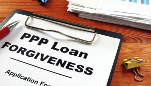 Paycheck Protection Program PPP Loan forgiveness application form. | Adobe Stock