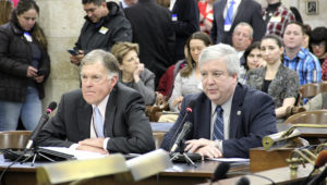 NJ Chamber President and CEO Tom Bracken and Senior Executive Vice President Michael Egenton urge legislators to take a common sense approach on minimum wage increases, as labor union members look on. Their testimony came during a State House Committee meeting on Jan. 24, 2019.