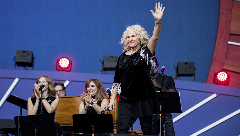 FILE - In this Sept. 28, 2019, file photo, Carole King waves to the crowd as she takes the stage at the 2019 Global Citizen Festival in New York. (AP Photo/Julius Constantine Motal, File)