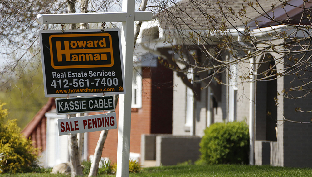 This Monday, April 27, 2020, file photo shows a sale pending sign on a home in Mount Lebanon, Pa. The coronavirus pandemic helped shape the housing market by influencing everything from the direction of mortgage rates to the inventory of homes on the market to the types of homes in demand and the desired locations. (AP Photo/Gene J. Puskar, File)