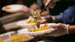 Stuffing is put onto a dinner plate Tuesday at Townhall restaurant in Cleveland, November 22, 2016, during their 4th annual Feed the Need event. | David Petkiewicz, cleveland.com