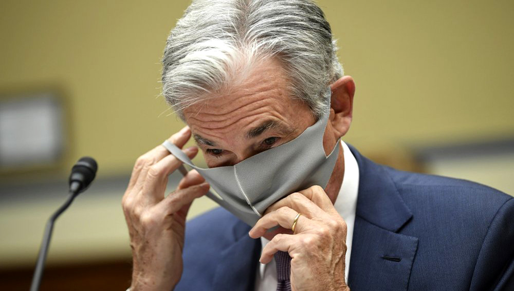Federal Reserve Chair Jerome Powell takes off his face mask to testify during a House Select Subcommittee on the Coronavirus Crisis hearing on Capitol Hill in Washington on Wednesday, Sept. 23, 2020. (Kevin Dietsch/Pool via AP)