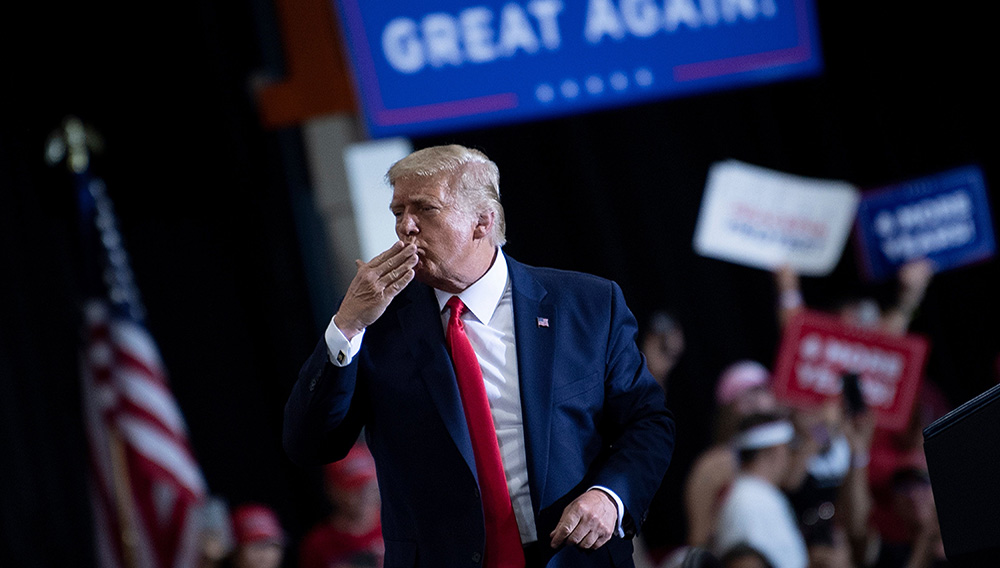 U.S. President Donald Trump blows a kiss to supporters after speaking during an indoor campaign rally at Xtreme Manufacturing in Henderson, a suburb of Las Vegas, Nevada, on Sep. 13, 2020. (Brendan Smialowski / AFP via Getty Images)