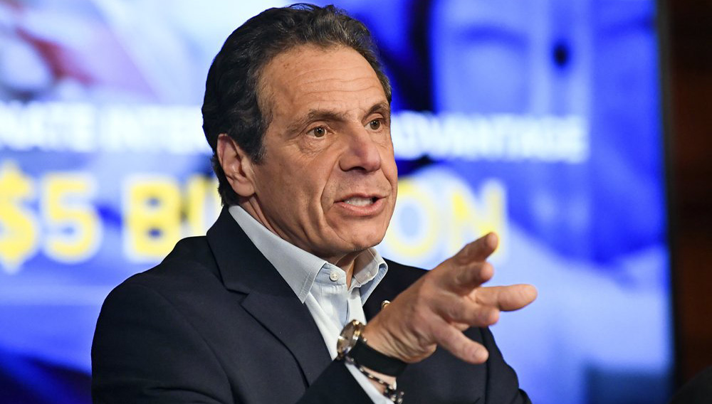 FILE - In this March 31, 2020 file photo, New York Gov. Andrew Cuomo speaks about the $175.5 billion state budget during a news conference in the Red Room at the state Capitol in Albany, N.Y. Spending cuts are compounding for schools and state programs, reserve funds are dwindling, and some governors have begun proposing new taxes and fees to shore up state finances shaken by the coronavirus pandemic. (AP Photo/Hans Pennink, File)