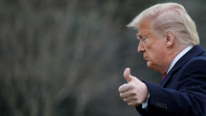 US President Donald Trump gestures to reporters from the White House lawn on March 5. | Photo: Reuters