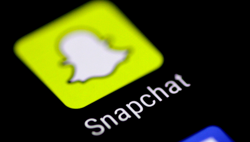 FILE PHOTO: The Snapchat messaging application is seen on a phone screen August 3, 2017. REUTERS/Thomas White