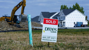 A "sold" sign sits on a lot as new home construction continues in Westfield, Ind., Friday, Sept. 25, 2020. U.S. home construction rose a solid 1.9% in September after having fallen in August as home building remains one of the bright spots for the economy. (AP Photo/Michael Conroy)