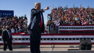 President Donald Trump gestures to supporters as he arrives for a campaign rally at Phoenix Goodyear Airport, Wednesday, Oct. 28, 2020, in Goodyear, Ariz. (AP Photo/Evan Vucci)