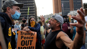 Supporters of President Donald Trump and protesters interact with each other at Independence Mall, Tuesday, Sept. 15, 2020, in Philadelphia. President Trump participated in a town hall at the National Constitution Center. (AP Photo/Michael Perez)