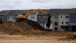 A construction crew loads dirt on a building site, Monday, May 18, 2020 in East Greenwich, N.J. | Matt Slocum, AP