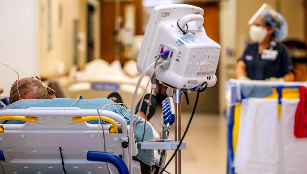 A patient is shown sitting in a hallway at the Houston Methodist The Woodlands Hospital on August 18, 2021 in Houston, Texas. (Photo by Brandon Bell/Getty Images)