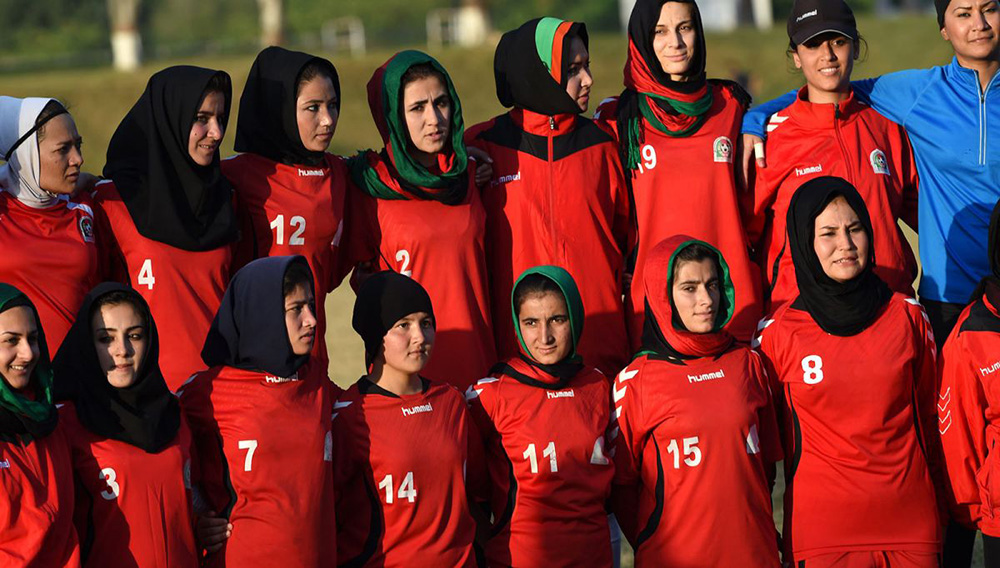 Afghanistan women's football team poses for a picture after practice during the SAFF Women's Championship in Islamabad, Pakistan; 2014 (x-post r/Afghanistan)