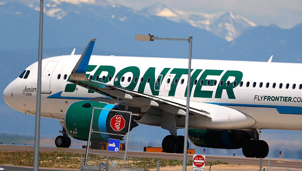 In this June 10, 2020 file photo, a Frontier Airlines jet heads down a runway for take off from Denver International Airport as travelers deal with the effects of the new coronavirus in Denver. (AP Photo/David Zalubowski, File)