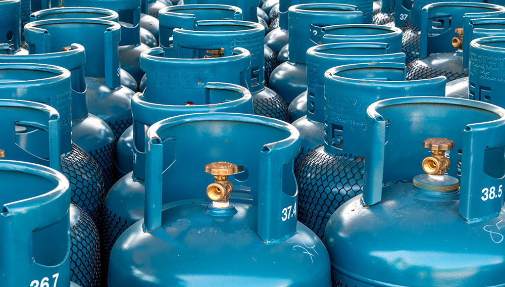 LPG gas bottle stack ready for sell, filling lpg gas bottle. | AdobeStock