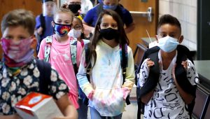 Wearing masks to prevent the spread of Covid-19, elementary students began their school day in Godley, Texas. | PHOTO: LM OTERO/ASSOCIATED PRESS