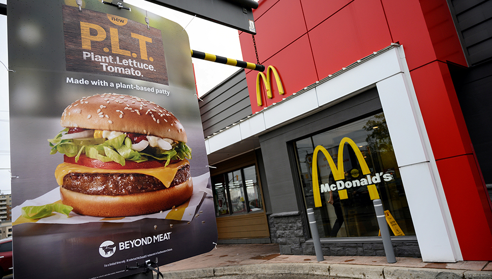 A sign promoting McDonald's "PLT" burger with a Beyond Meat plant-based patty at one of 28 test restaurant locations in Ontario, Canada October 2, 2019. REUTERS/Moe Doiron/File Photo