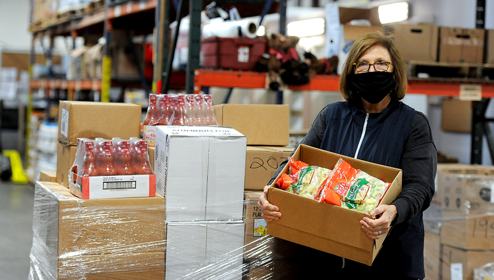 Catherine D'Amato, executive director of the Greater Boston Food Bank, visited the Family Pantry of Cape Cod in Harwich Monday morning. | PHOTO: Merrily Cassidy/Cape Cod Times