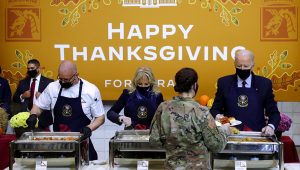 U.S. President Joe Biden and first lady Jill Biden serve food during a Thanksgiving event with U.S. service members and military families at Fort Bragg, North Carolina, U.S., November 22, 2021. PHOTO: REUTERS/Leah Millis