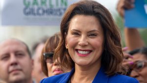 Democratic gubernatorial candidate Gretchen Whitmer announces Garlin Gilchrist II as her choice for lieutenant governor at the pothole-riddled intersection of Seymour Ave and Shiawassee St. in Lansing on Monday, Aug. 20, 2018. Cory Morse | MLive.com